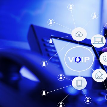 phonepower app pricing cost voip services hand dialing on voip phone blue background